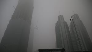 I grattacieli di Pechino immersi nello smog. Foto Ansa