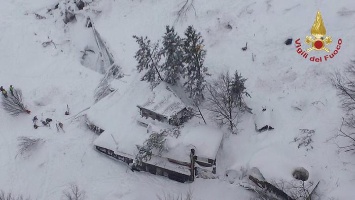 epa05729985 A handout picture provided by the Italian Fire Department shows an aeroal view of hotel Rigopiano after it was hit by an avalanche in Farindola (Pescara), Abruzzo region, early 19 January 2017. According to an Italian mountain rescue team, several people have been killed in an avalanche that has hit a hotel near the Gran Sasso mountain in Abruzzo region. Authorities believe that the avalanche was apparently triggered by a series of earthquakes in central Italy on 18 January. EPA/ITALIAN FIRE DEPARTMENT HANDOUT BEST QUALITY AVAILABLE HANDOUT EDITORIAL USE ONLY/NO SALES