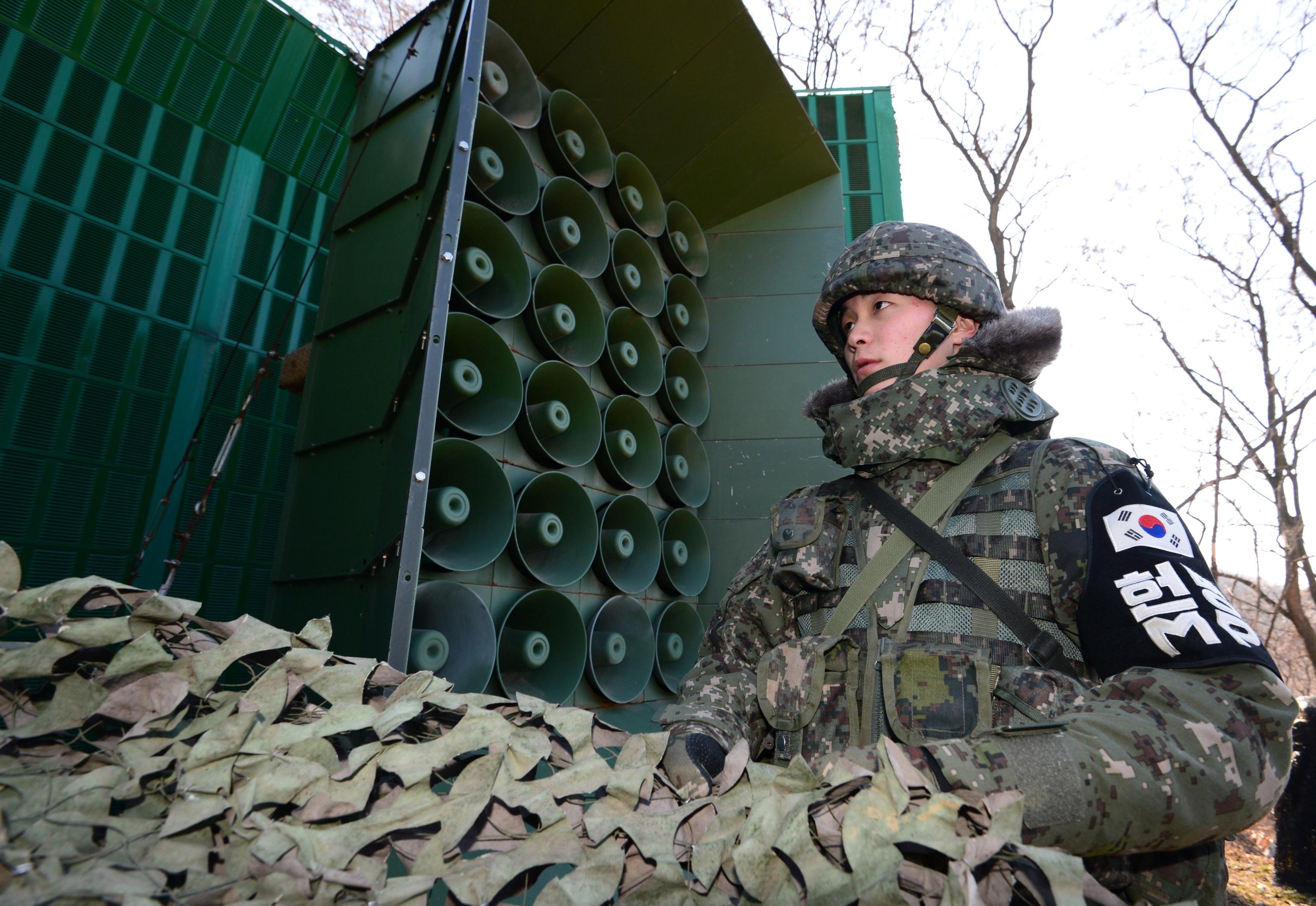 epaselect epa05795966 An undated photo made available on 16 February 2017 shows a South Korean soldier standing near loudspeakers at the border with North Korea, at an undisclosed location in South Korea. South Korea said on 15 February 2017, it will use loudspeakers along the inter-Korean border to inform North Koreans of the murder of North Korean leader Kim Jong-un's half-brother Kim Jong-nam. Kim Jong-nam was reportedly killed by two women at an airport in Kuala Lumpur, Malaysia, on 13 February 2017. EPA/YONHAP SOUTH KOREA OUT
