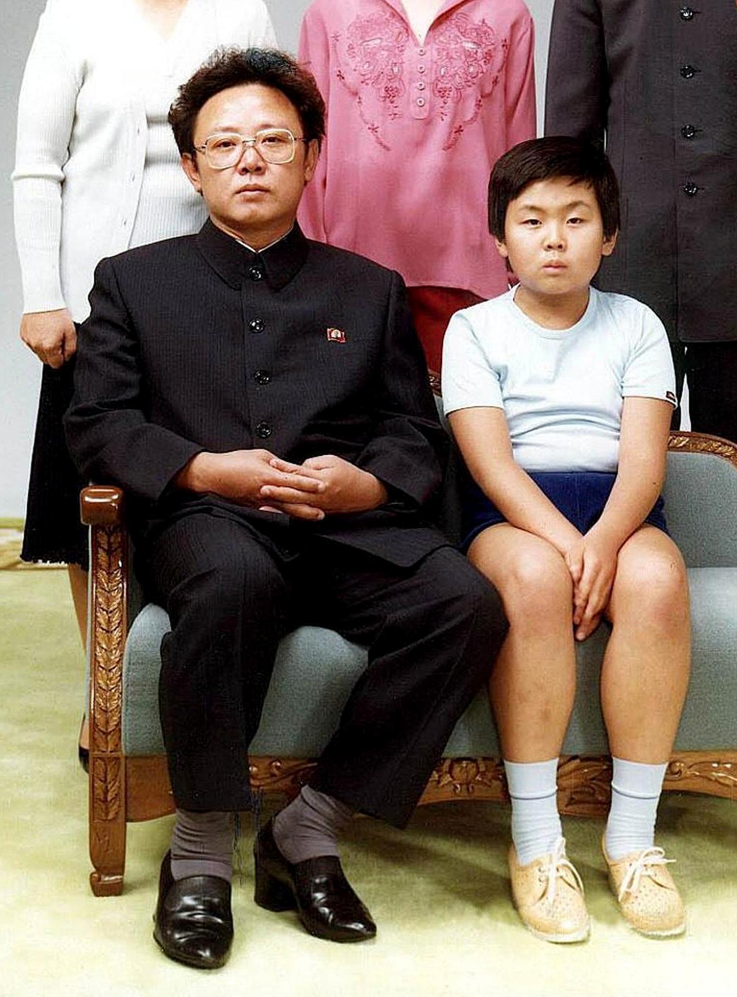 This file photo taken 19 August 1981 in Pyongyang and recently released shows North Korean leader Kim Jong-Il (L) sitting with his son, Jong-Nam (R). A man believed to the the eldest son of Kim Jong-Il, Kim Jong-Nam, was seized by Japanese immigration officials at Tokyo's Narita international airport, news reports said 03 May 2001. The younger Kim, now said to be 30-years-old, was stopped with a false passport believed to be issued by a country in either Central or South America. (KOREA OUT) ANSA/cyk/rab