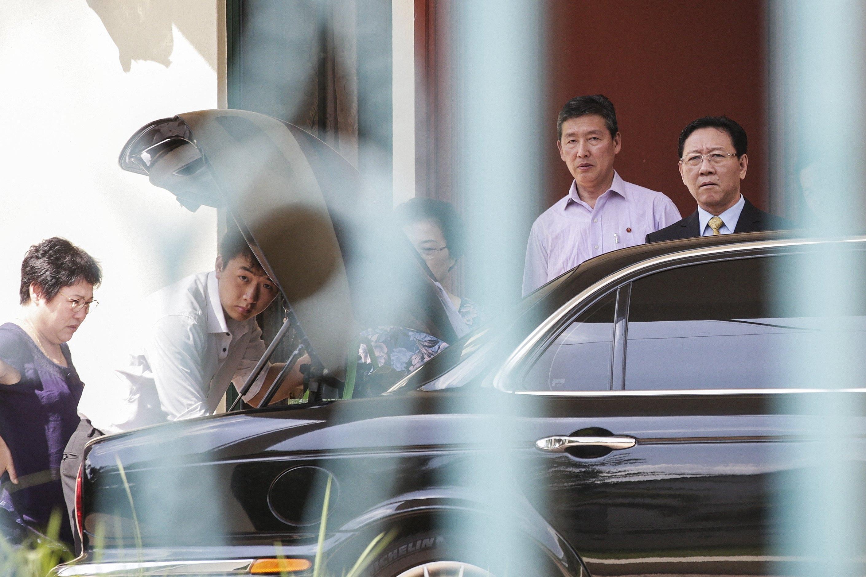 epa05832458 North Korea's ambassador to Malaysia, Kang Chol (R), reacts while leaving the North Korean embassy in Kuala Lumpur, Malaysia, 06 March 2016. Others are not identified. Malaysia's government said on 04 March it would expel North Korea's Ambassador to Malaysia who has been declared 'persona non grata' and was ordered to leave the country within 48 hours, after he said Malaysia's investigation into the murder of Kim Jong-nam could not be trusted. Kim Jong-nam, a.k.a. Kim Chol, was attacked by two women with chemical sprays at a Kuala Lumpur airport on 13 February. According to authorities, the police are seeking arrest for a senior official at the North Korean Embassy in connection to the assassination of Kim. EPA/FAZRY ISMAIL